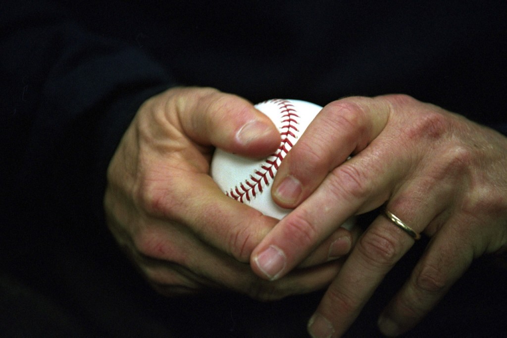 hands holding baseball